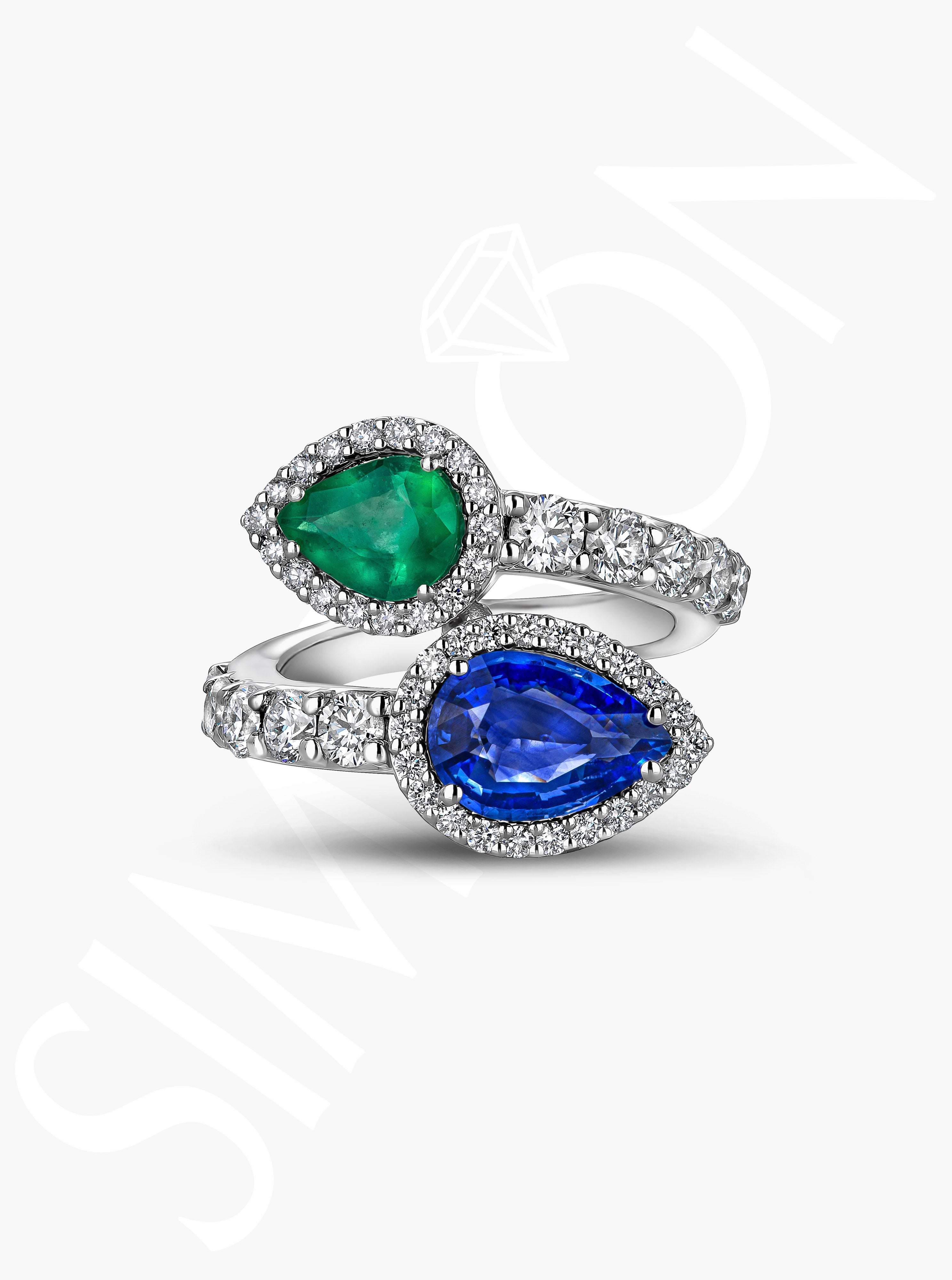 Emerald And Sapphire Crossover Ring With Diamond Halo