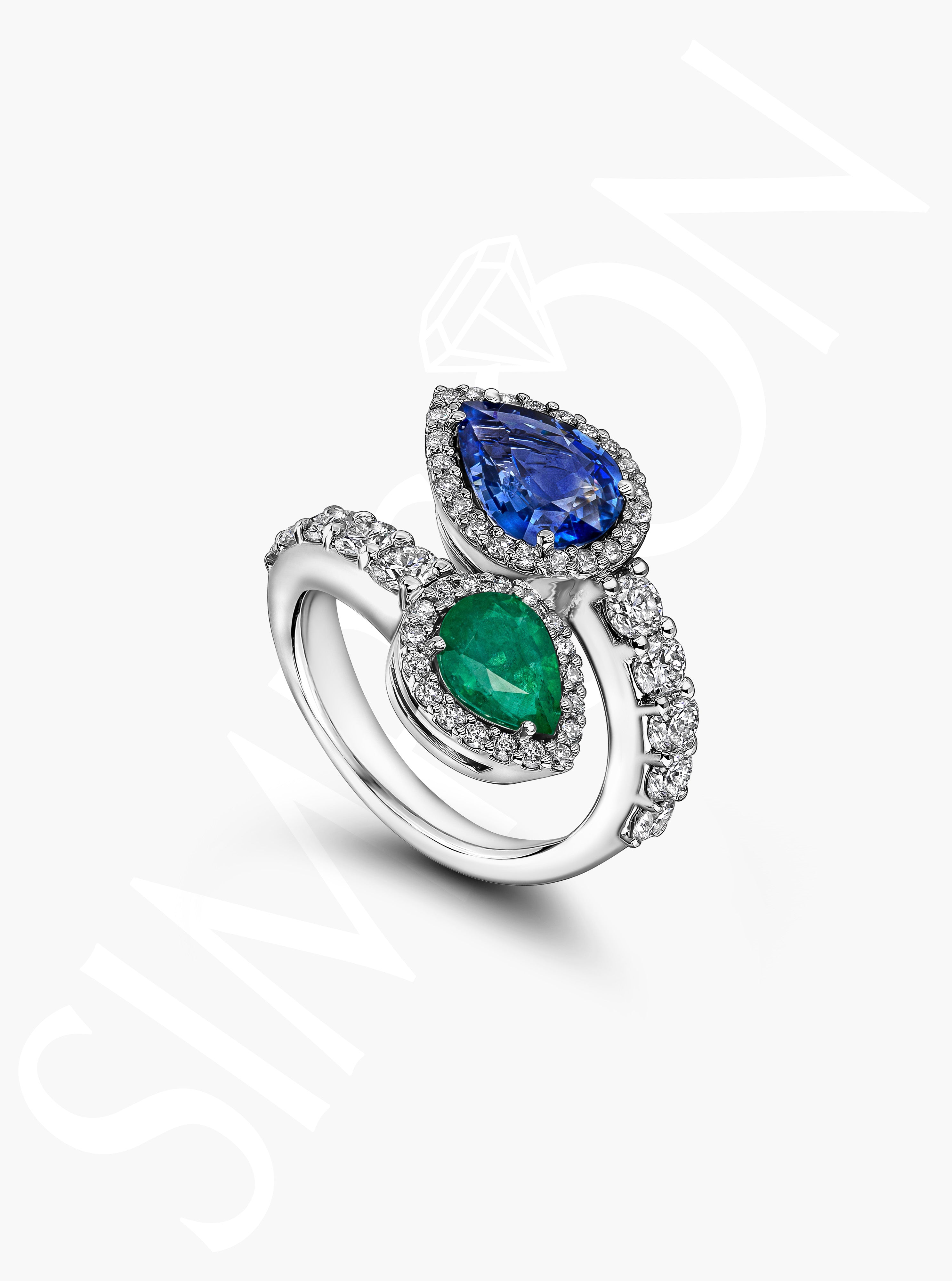 Emerald And Sapphire Crossover Ring With Diamond Halo